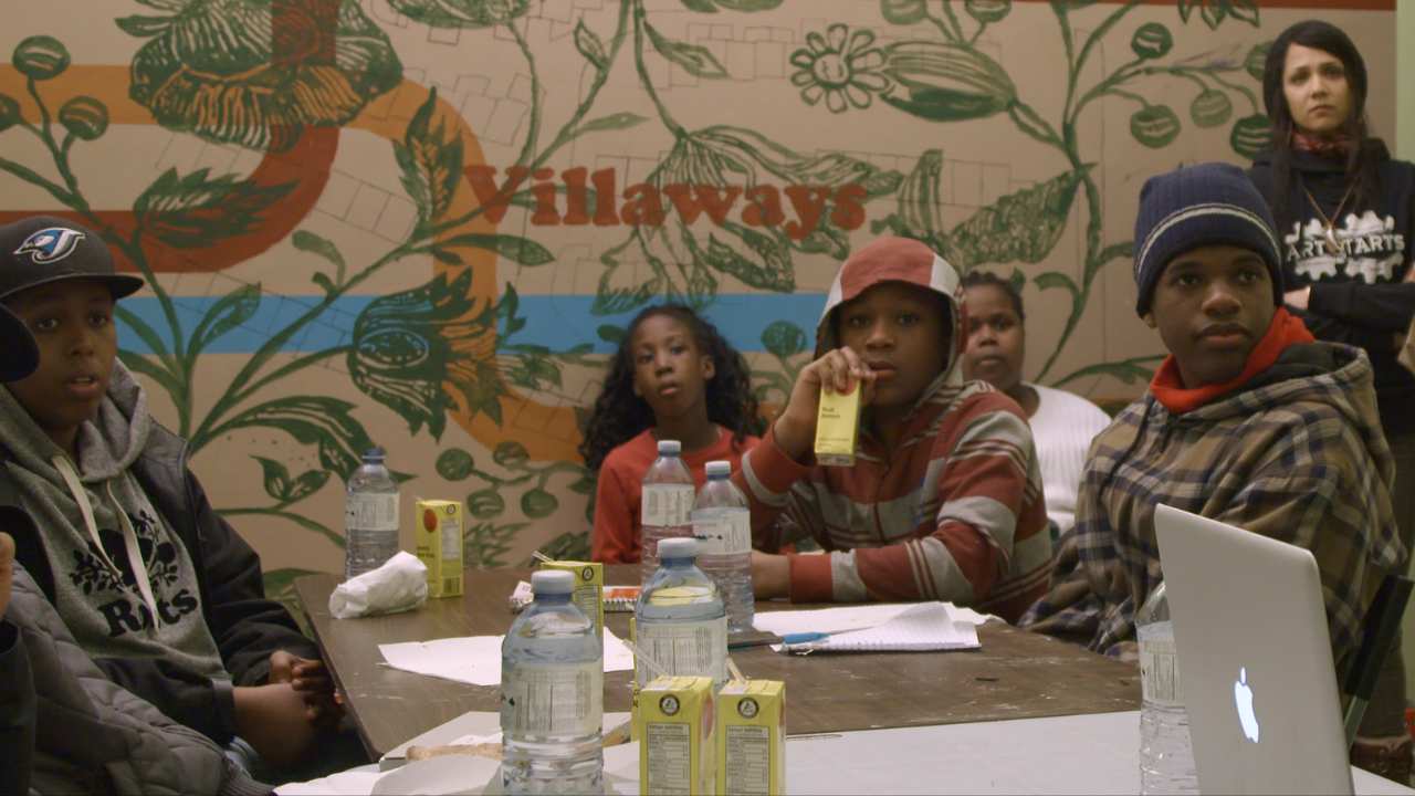 a group of kids having a snack together
